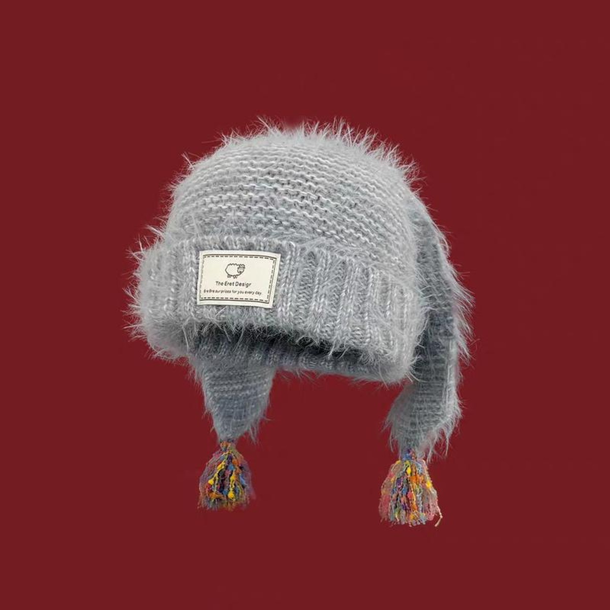 BUNNY-EAR TASSEL KNIT BEANIE. Grey