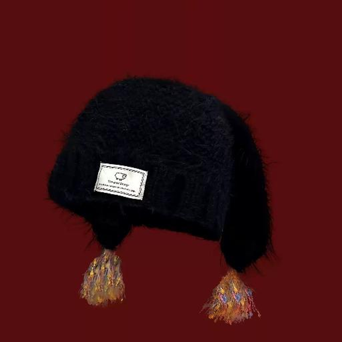 BUNNY-EAR TASSEL KNIT BEANIE. black