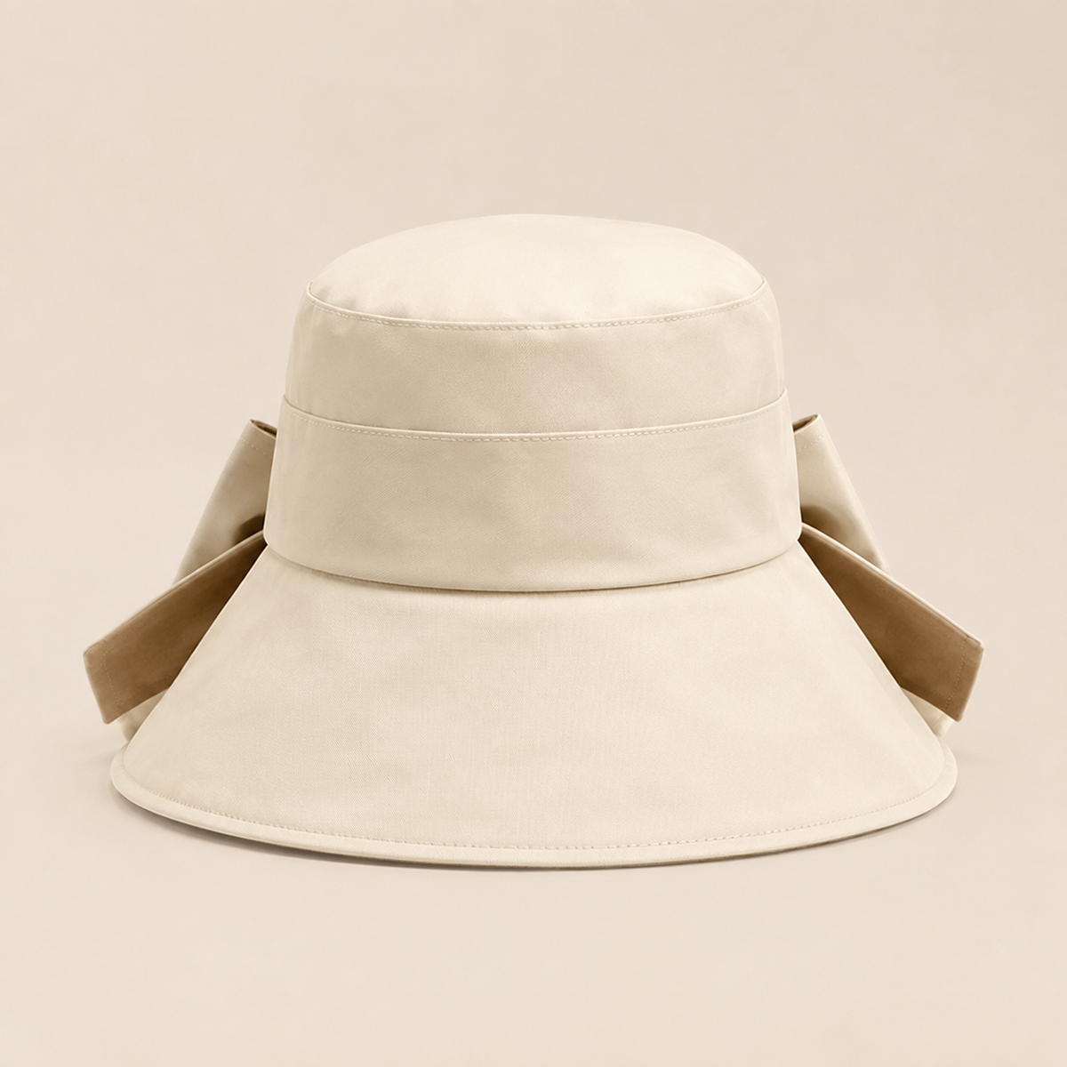 Front view of cream and beige bow-back wide-brim hat