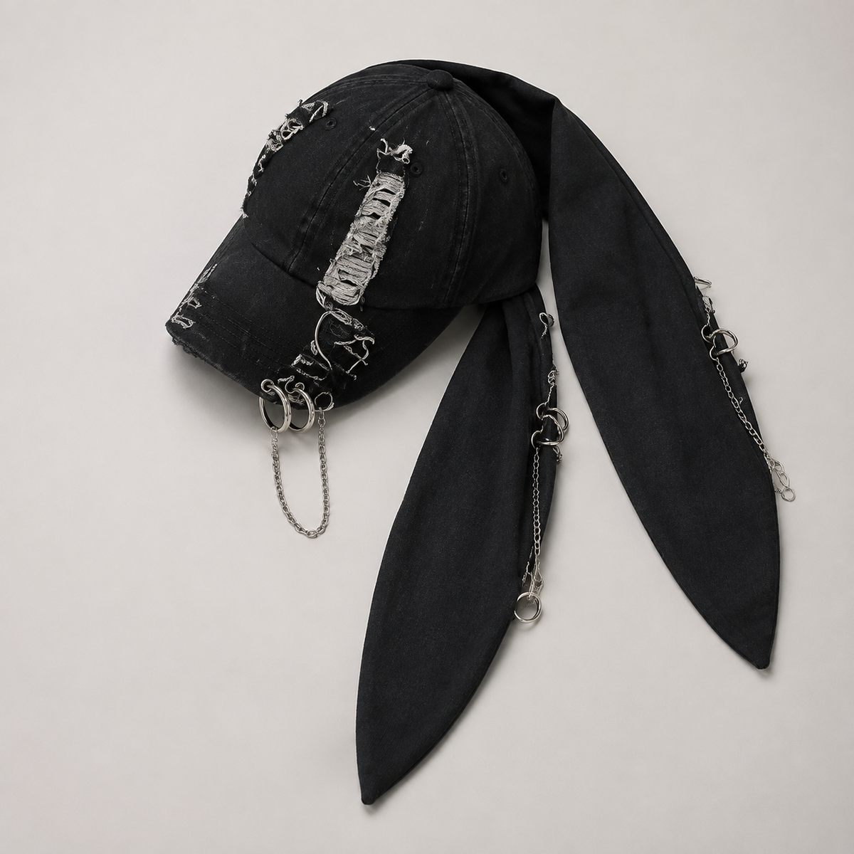 Top view of black bunny-ear chain cap
