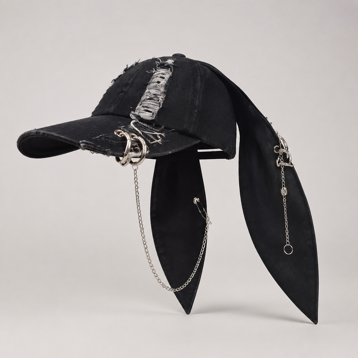 Side view of black bunny-ear chain cap