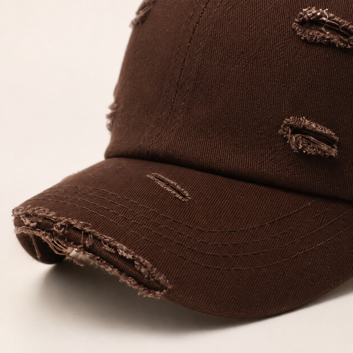Close detail of the distressed cotton and frayed brim edge