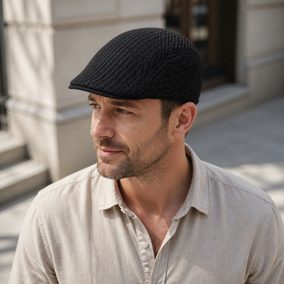 Black full mesh flat cap worn with a casual outfit