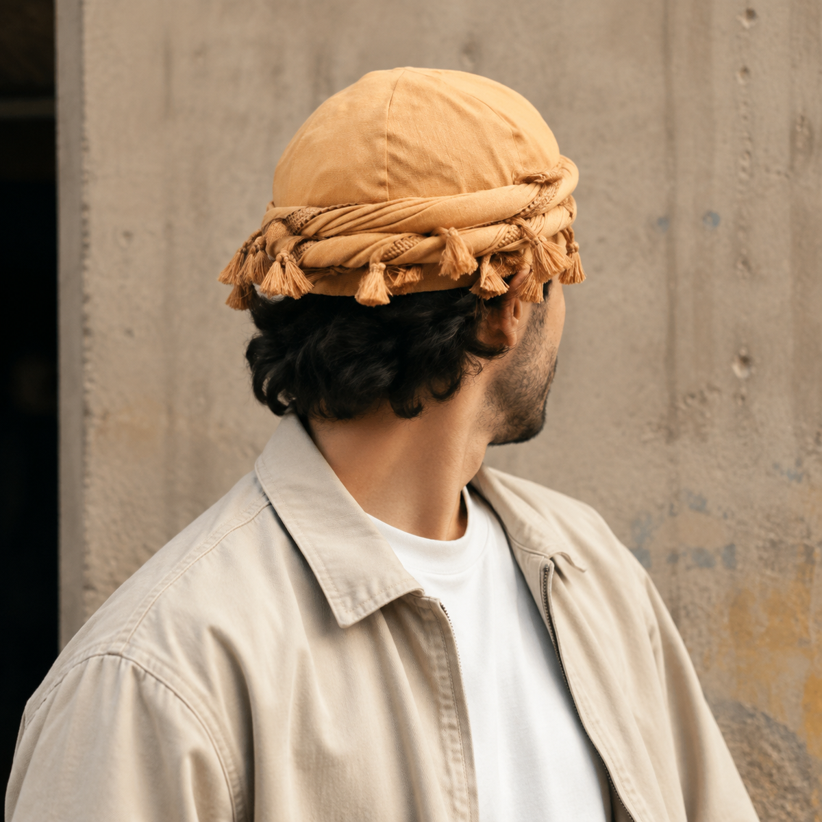 Orange tassel turban hat worn with casual streetwear