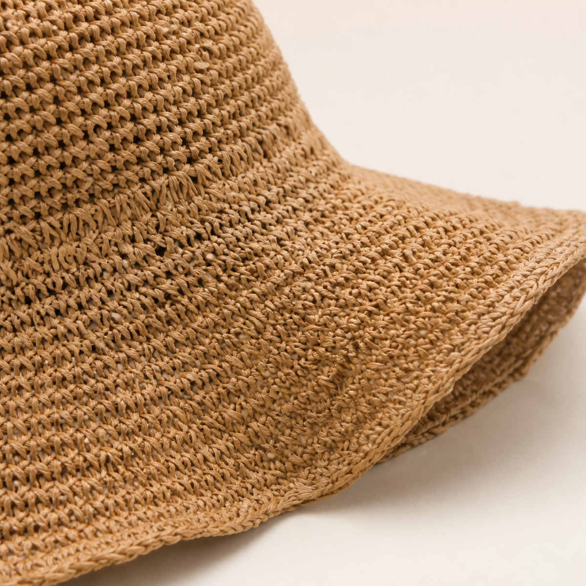 Close detail of the woven floppy hat